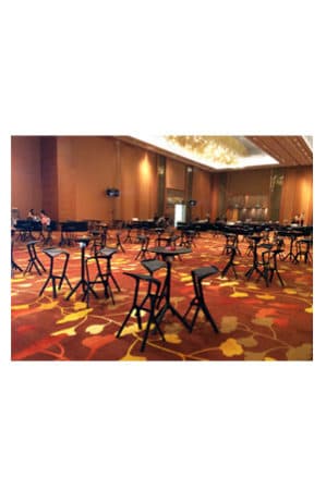 a large conference room with replica miura bar tables and chairs