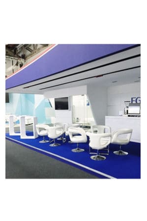 a blue and white booth with scoop swivel chairs and tables