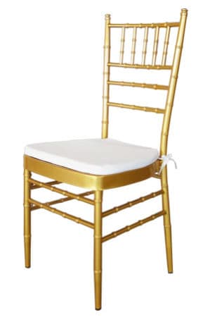 a gold tiffany chair with white cushion
