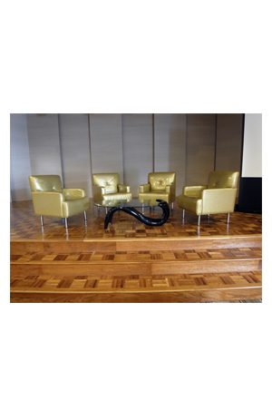 four replica panama coffee tables on a wooden floor in a conference room