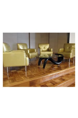 a group of chairs and a replica panama coffee table on a wooden floor