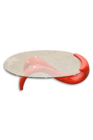 a red replica panama coffee table with a glass top