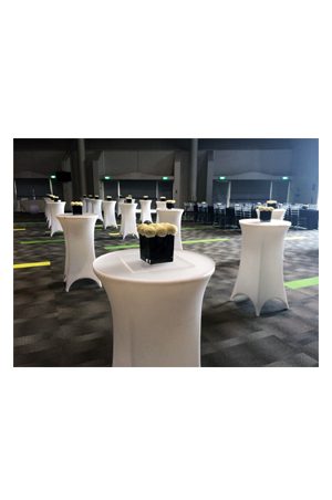 an illuminated baron bistro table with black chairs and a black tablecloth
