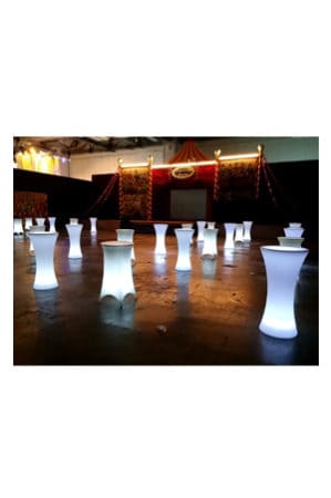 illuminated hourglass bistro tables in a large room
