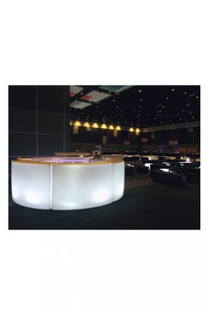 an illuminated circular bar with lights in the middle of a room