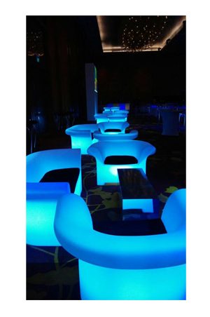 illuminated chesterfield sofa single seater lounge chairs with blue lights in a room