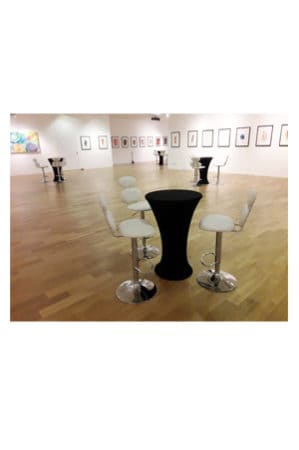 a black marshmallow barstool and chairs in an art gallery