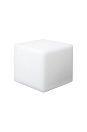 an illuminated cube 10 sitting on a white surface