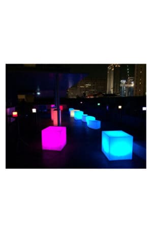 illuminated cubes on a rooftop at night