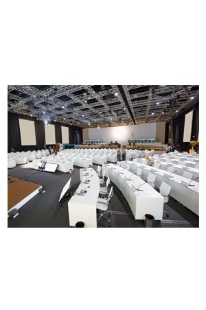 a large conference room with white tables and replica eames mesh executive chair midback chairs