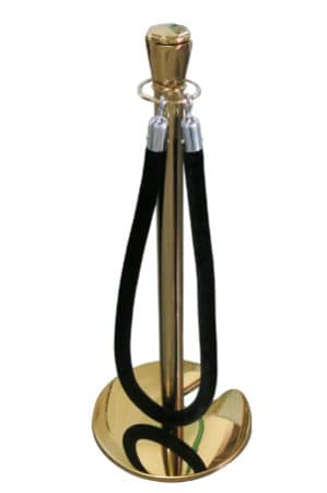 a classic gold pole with black rope stand with a black cord attached to it