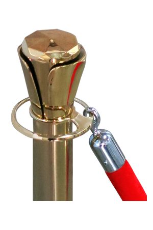 a classic gold pole with red rope with a red cord attached to it