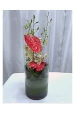 anthurium & orchid wrapped leave in cylinder